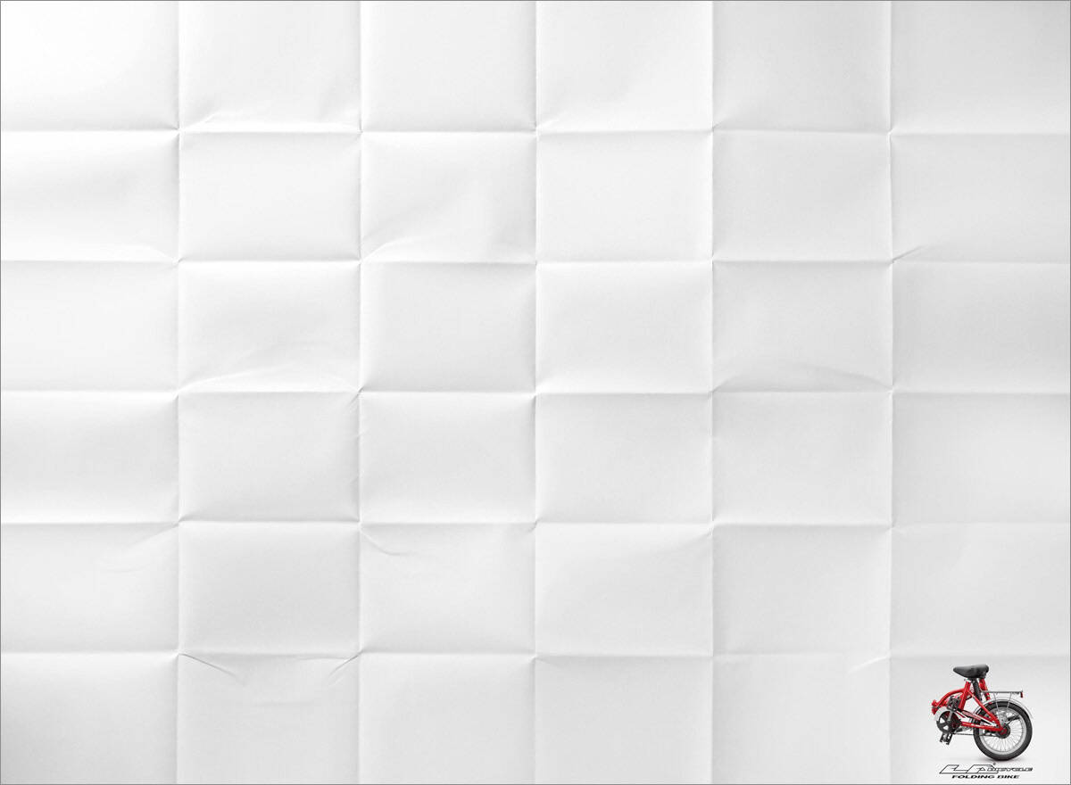 A folded paper with a folded bike in one corner.