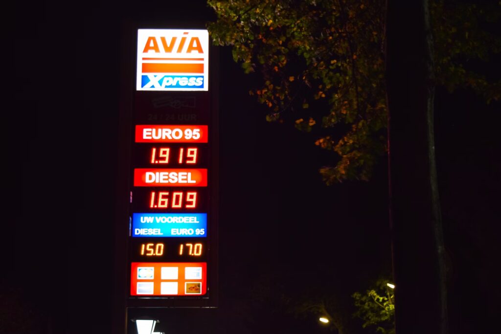 Gas station price sign representing a cooperative pricing strategy.