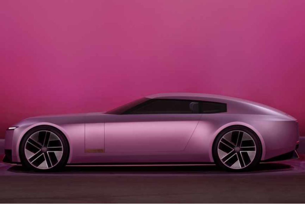 Jaguar's new electric vehicle showcased in a futuristic silhouette against a vibrant pink gradient background.