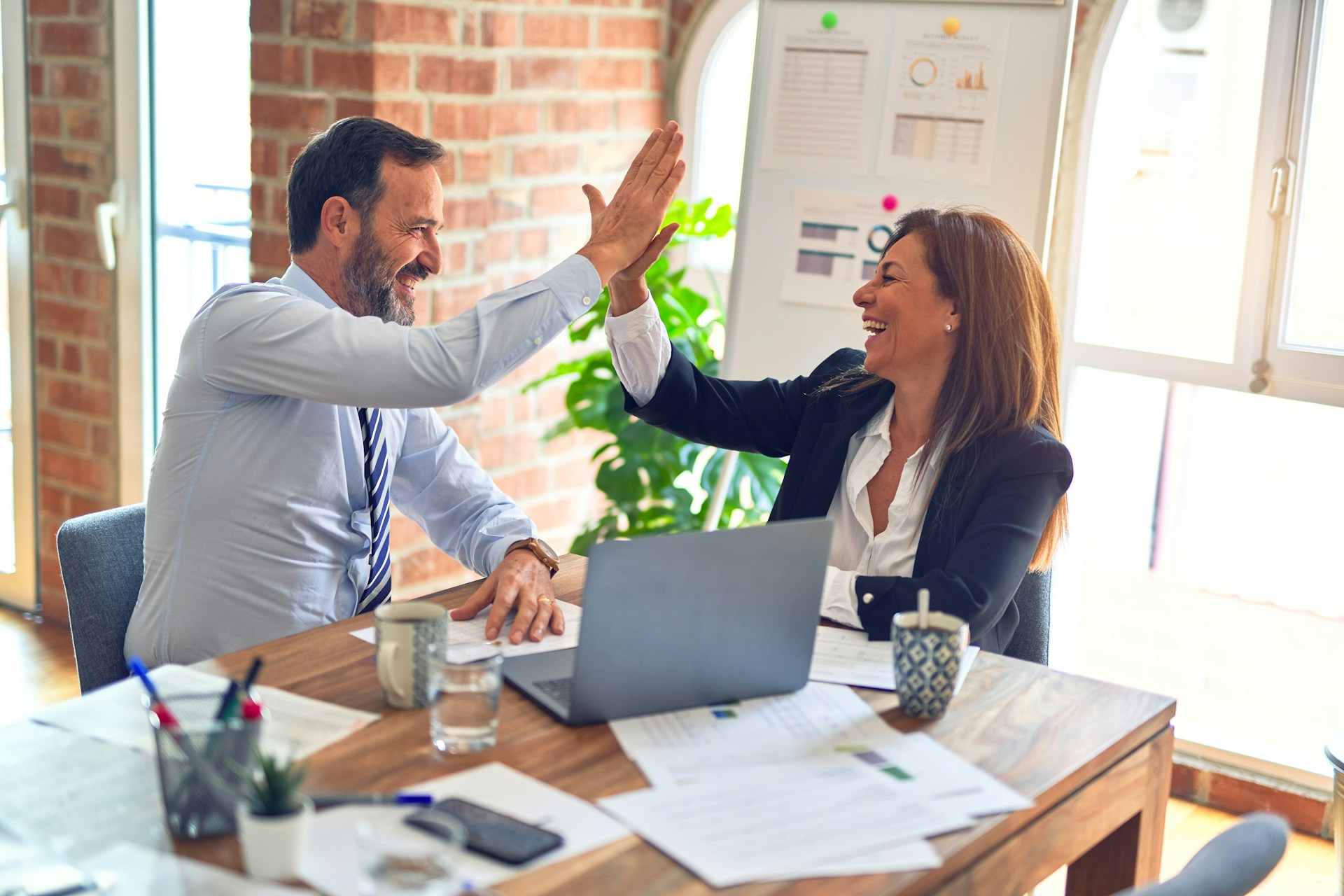 Man and Woman Giving a High Five