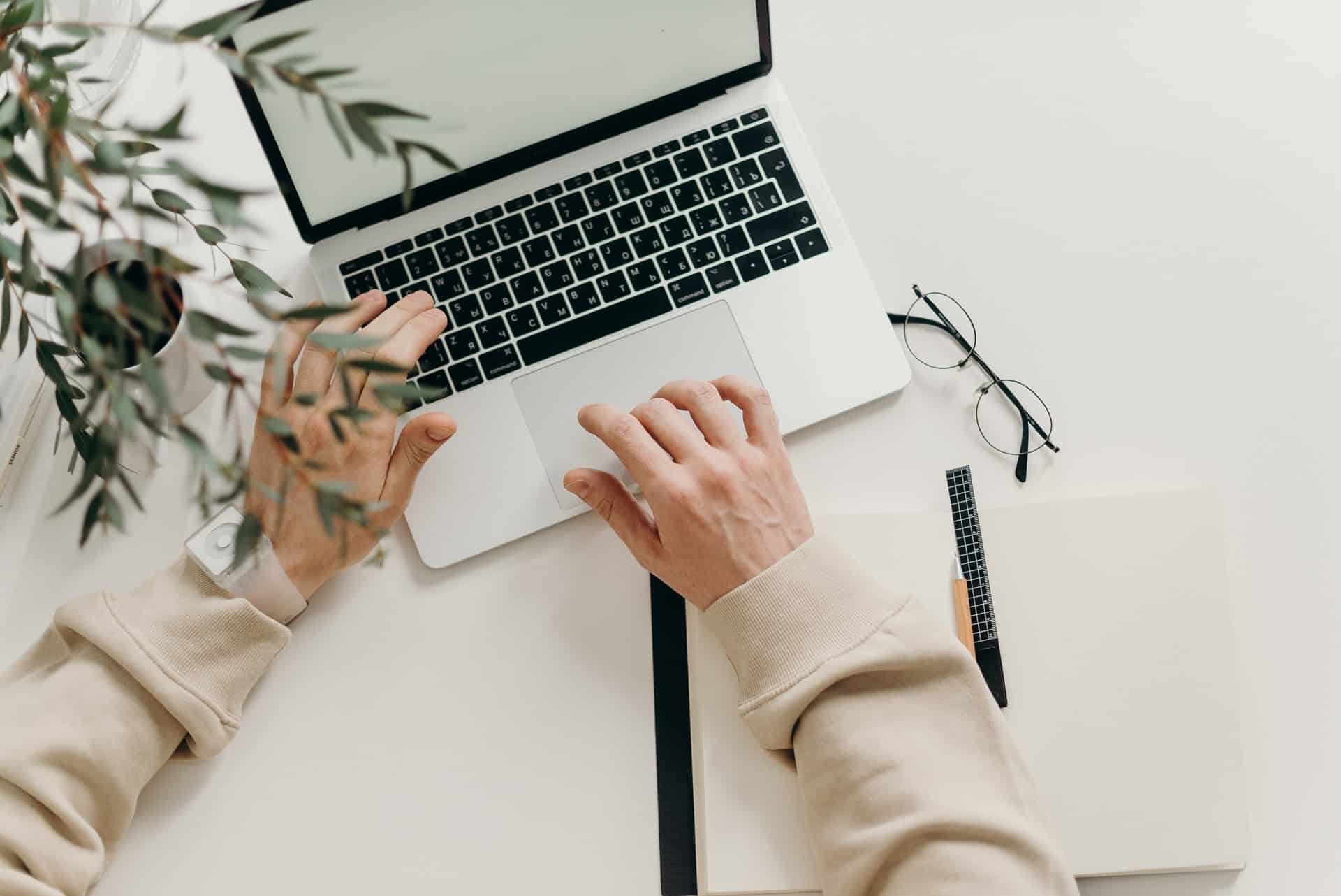 Woman typing on laptop