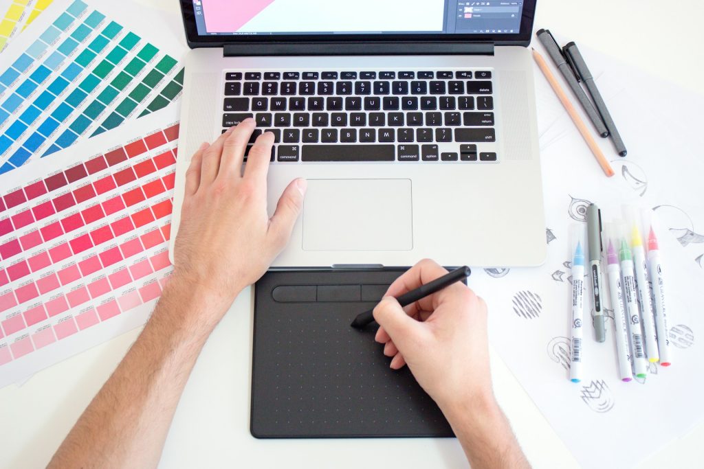 A graphic design tablet and color swatches