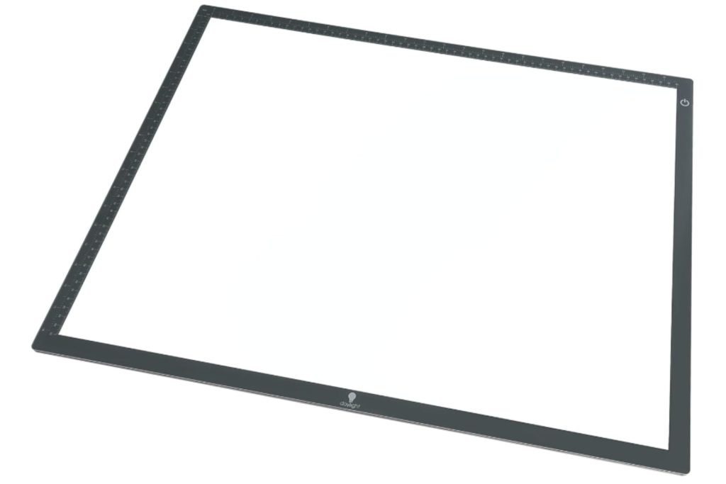 An ultra-thin tracing light box with a black frame featuring a marked ruler on the edges.