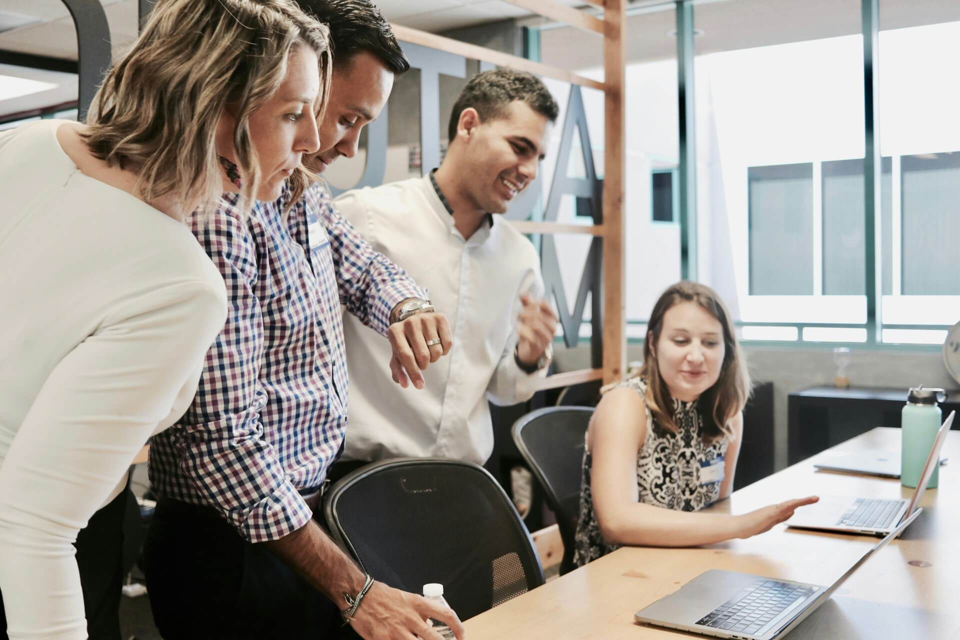 a marketing team huddled up in an office, brainstorming their next content marketing strategy