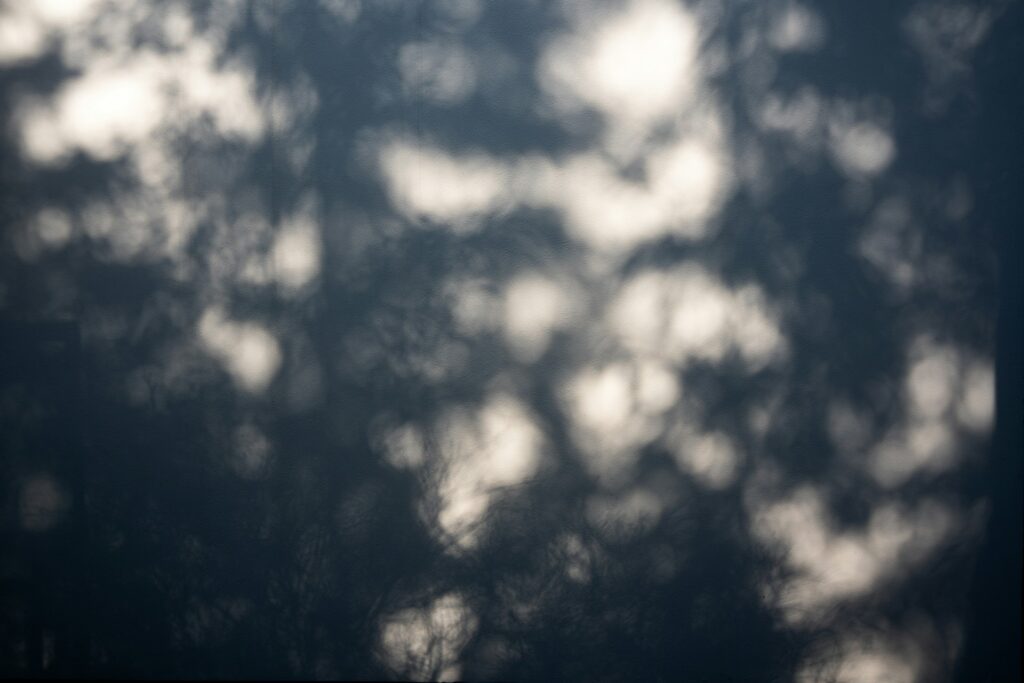 Dark shadow overlay on light background