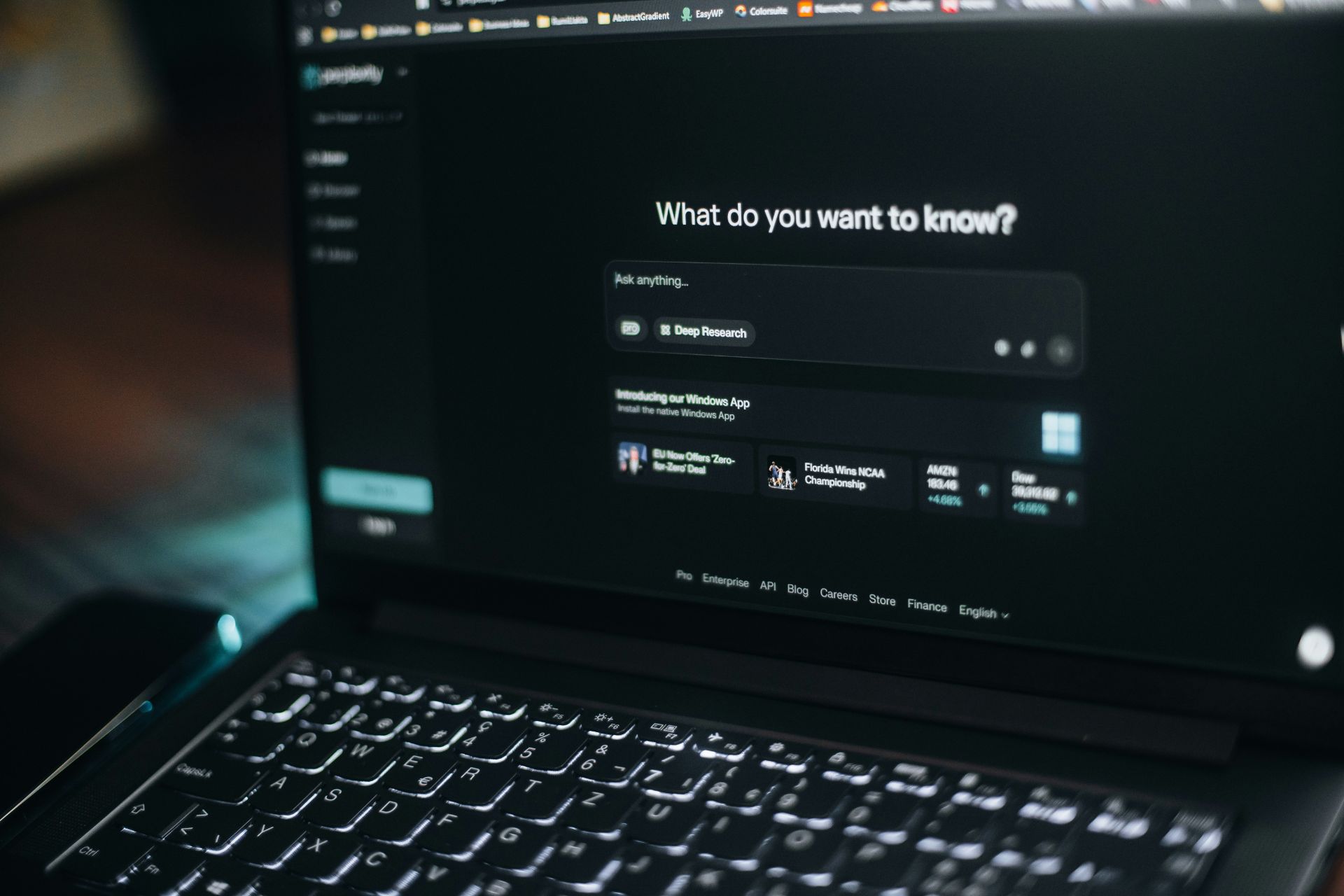 Laptop displaying an AI search interface on the screen