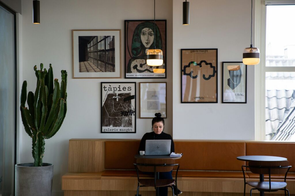 Freelancer working on a laptop in a modern cafe