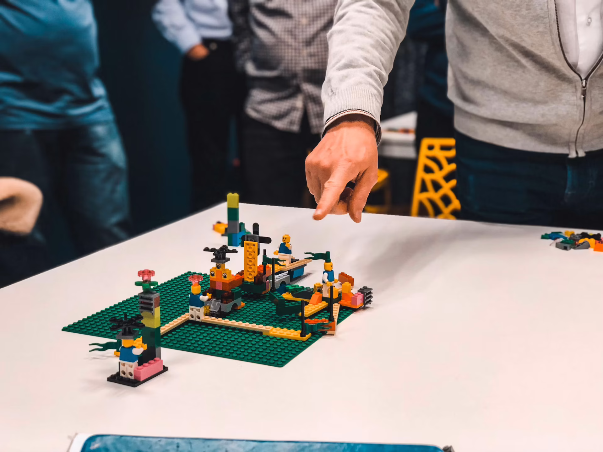 Team working on a Lego prototype, showcasing design thinking
