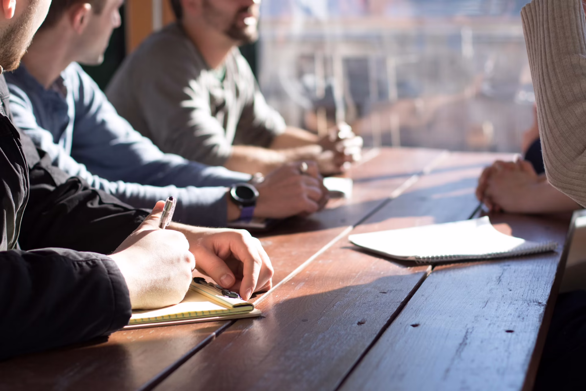 Close-up of hands of people in a meeting