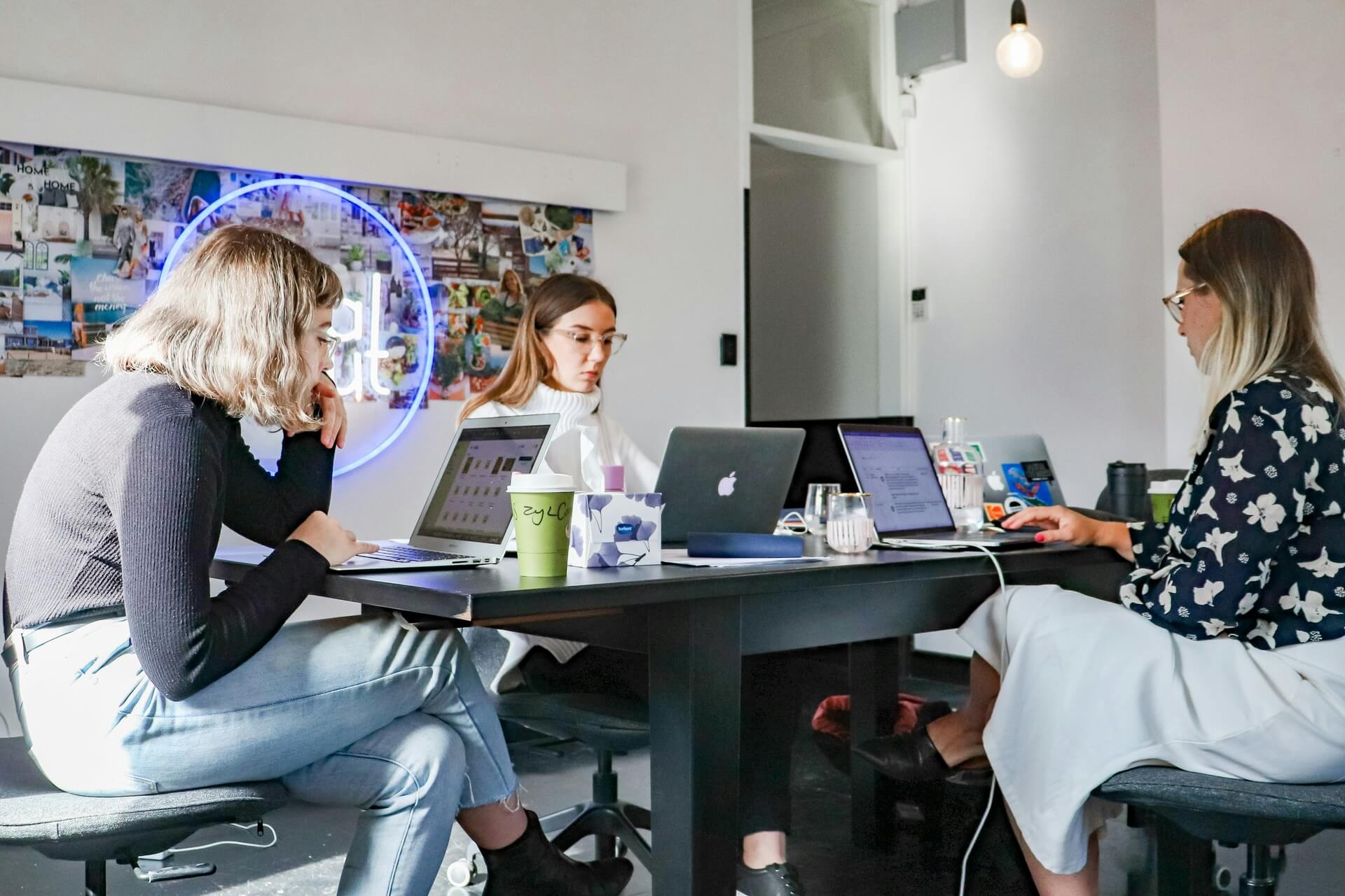 a group of marketing professionals huddled up at work