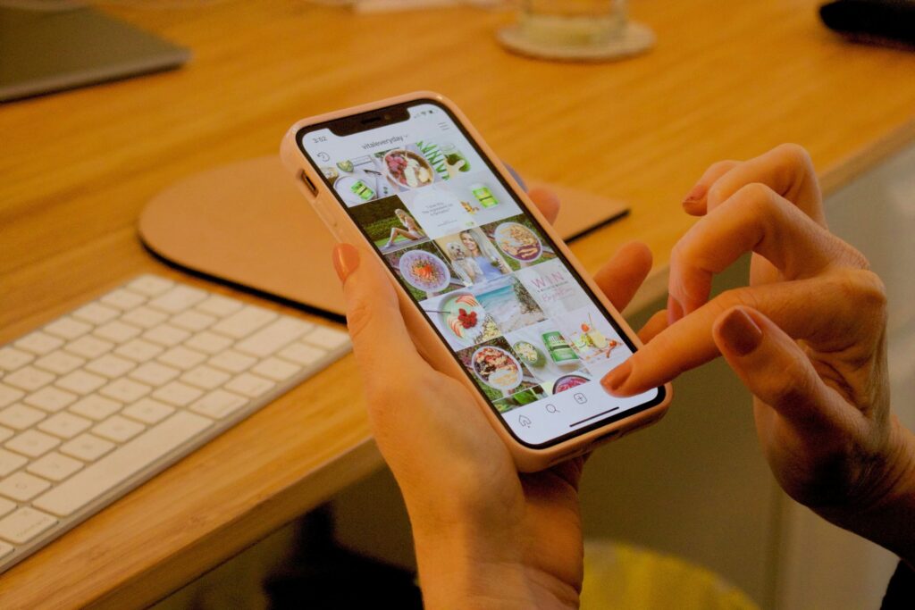 Person browsing social media content on a smartphone