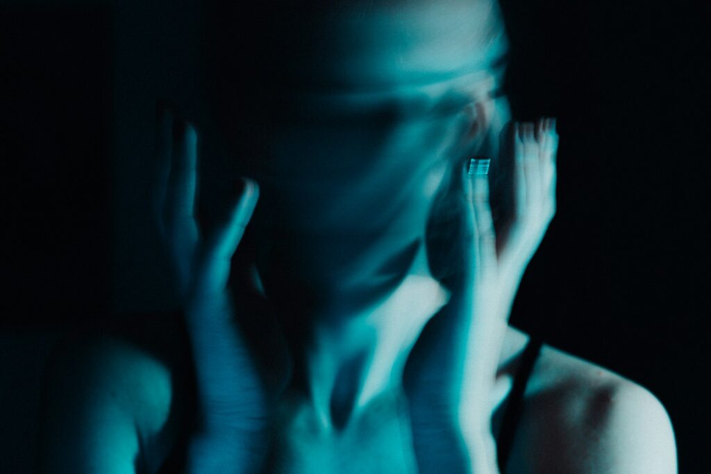 A blue, blurred face.