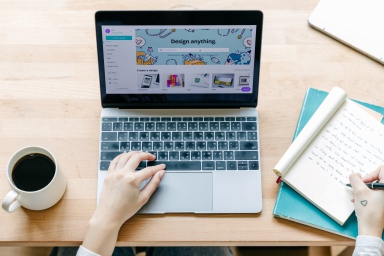 woman designing on laptop