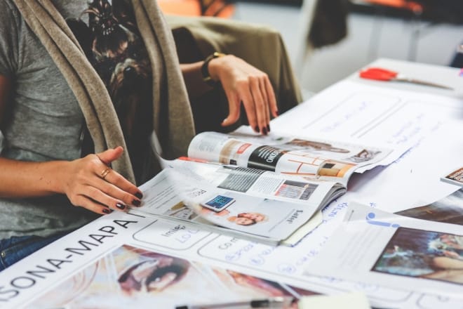 woman looking at magazine