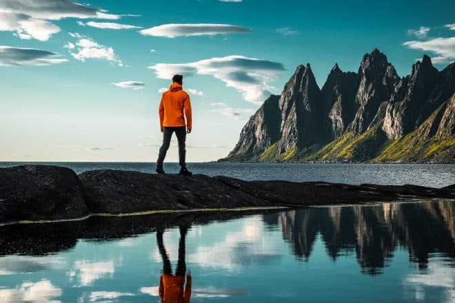 person overlooking water