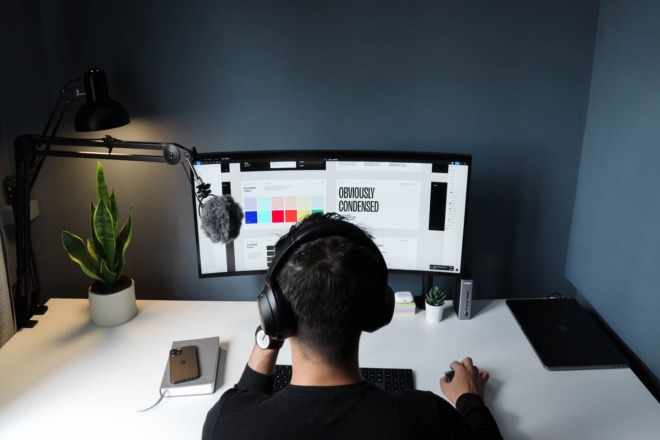 A freelancer working on a desktop computer
