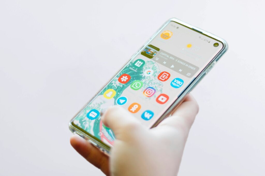 A person holding a smartphone in their hand.