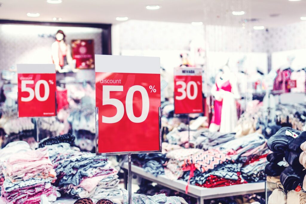 Red signs advertising a 50% off sale