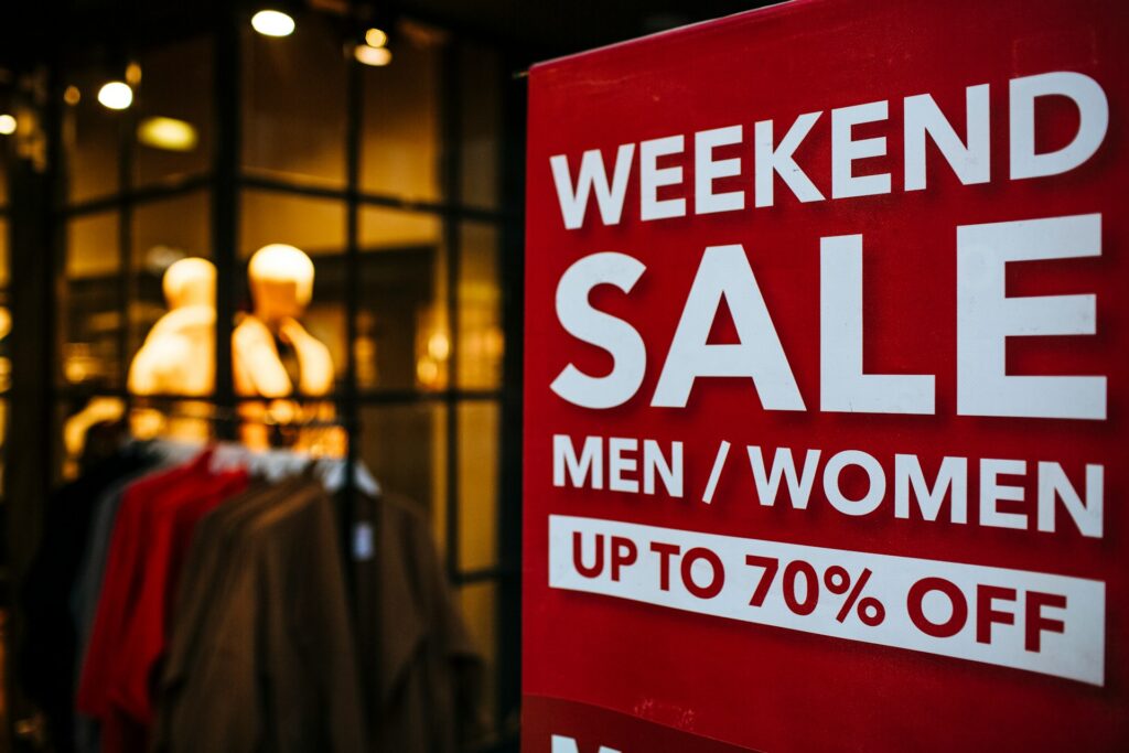 Red sign advertising a weekend 70% off sale