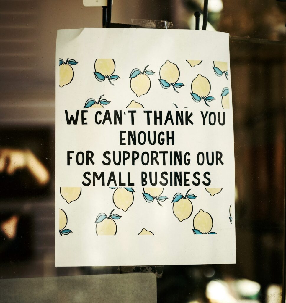 White sign that says "we can't thank you enough for supporting small business."