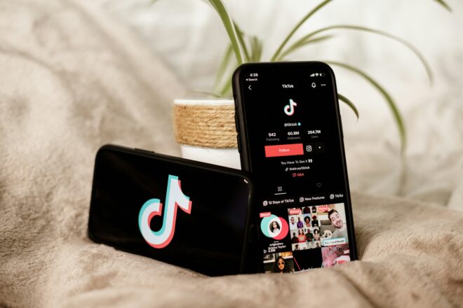 Two phones with TikTok open