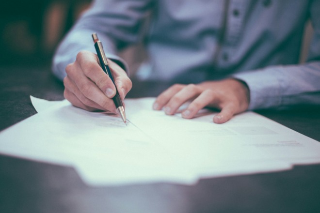 person signing job offer letter