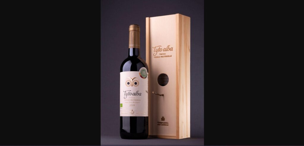 A wine bottle and wooden box
