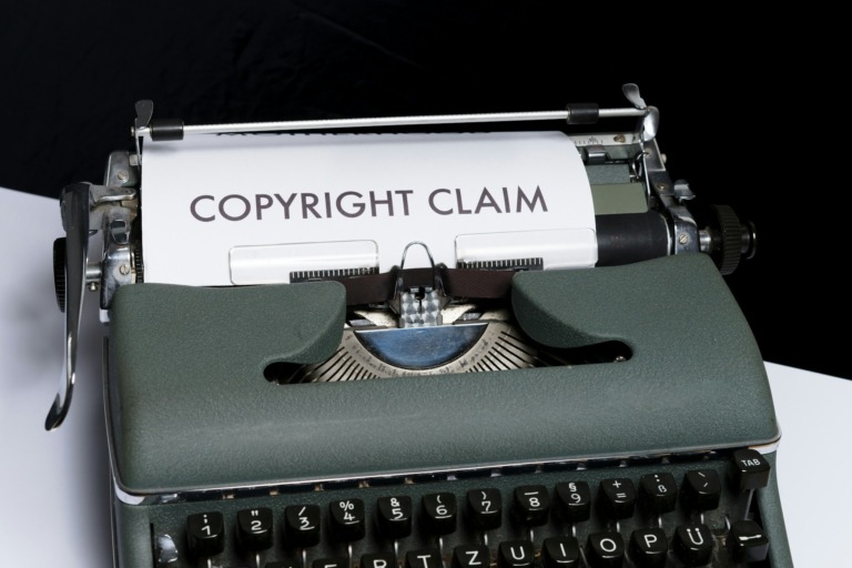 A typewriter with a document saying "copyright claim"