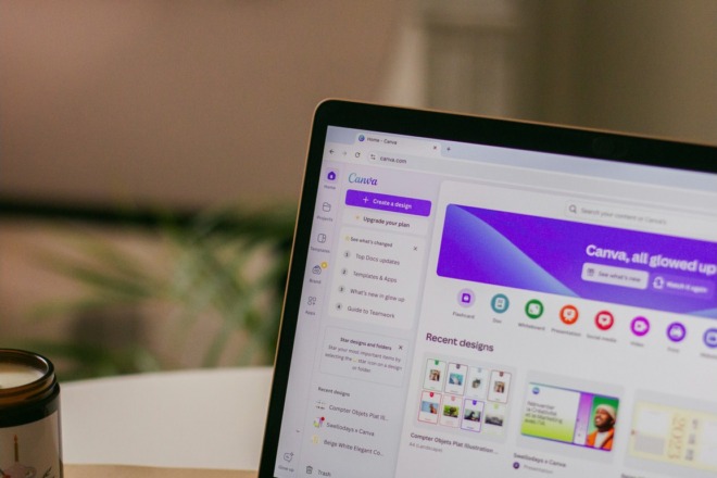 A laptop with Canva on the screen