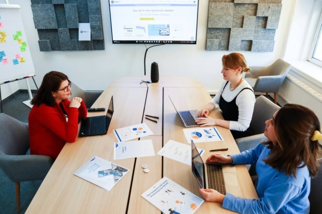 a team of marketers brainstorming on their company's brand voice guidelines