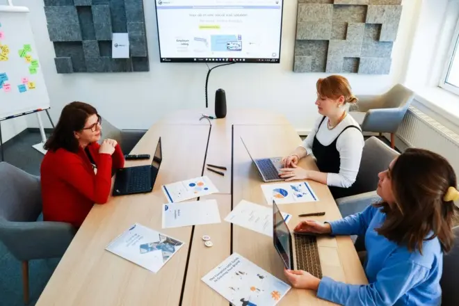 a team of marketers brainstorming on their company's brand voice guidelines