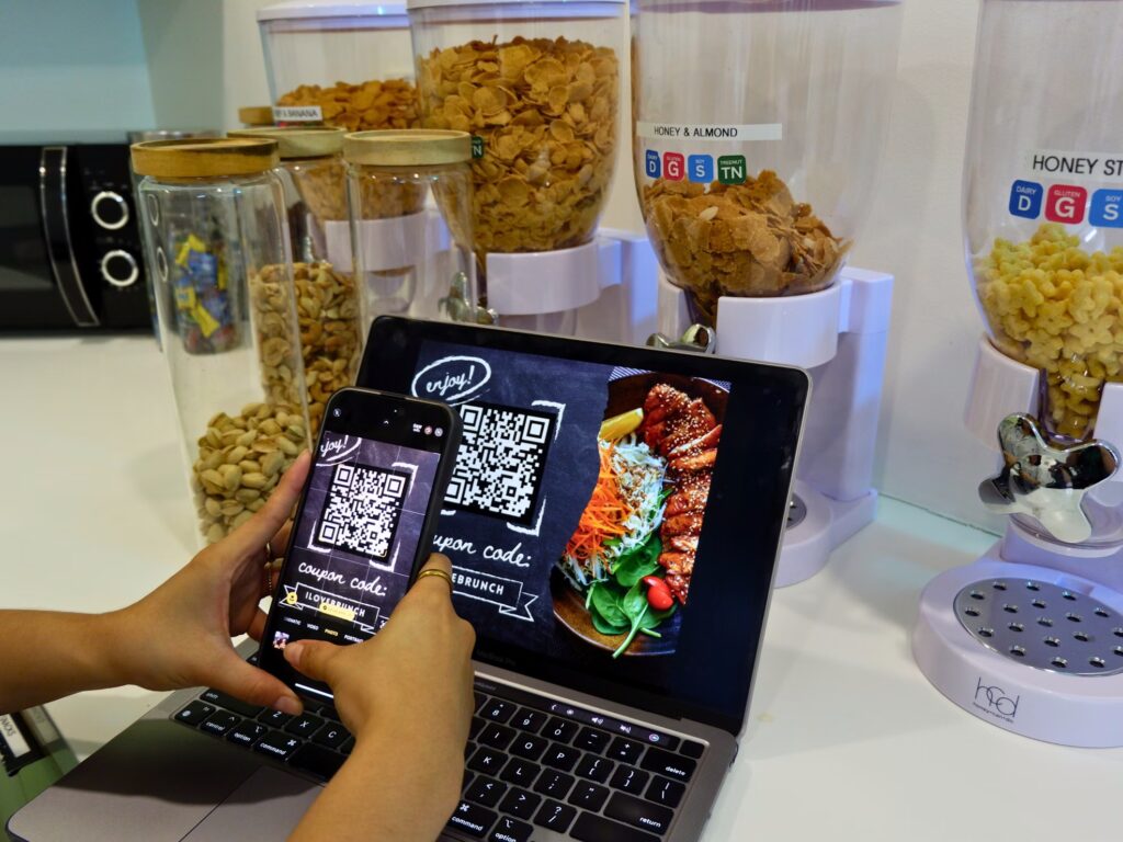 Person scanning a coupon code for a brunch restaurant